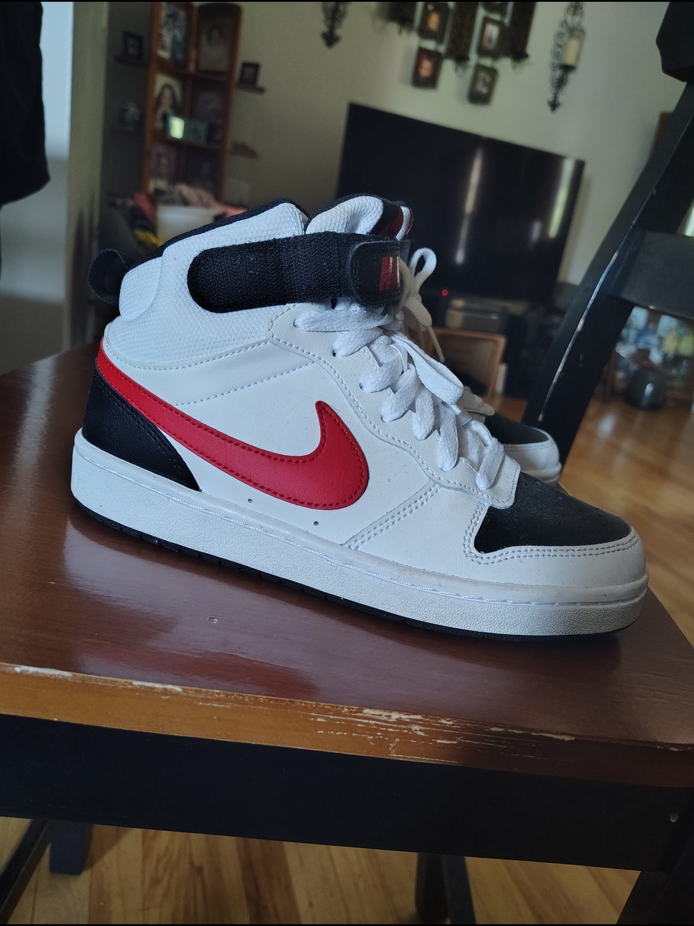 Nike White and Black High-Top Sneakers with Red Swoosh